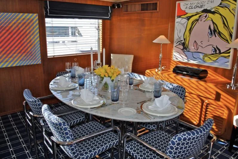 a table set with plates and glasses aboard GOING GALT Yacht for Sale