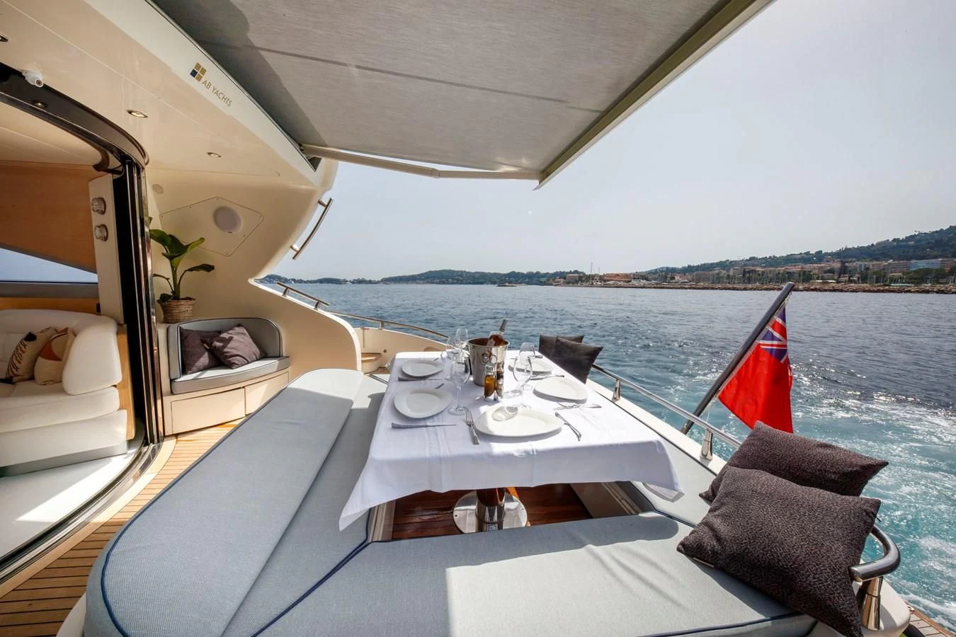 a table with chairs on it aboard KOKAB Yacht for Charter