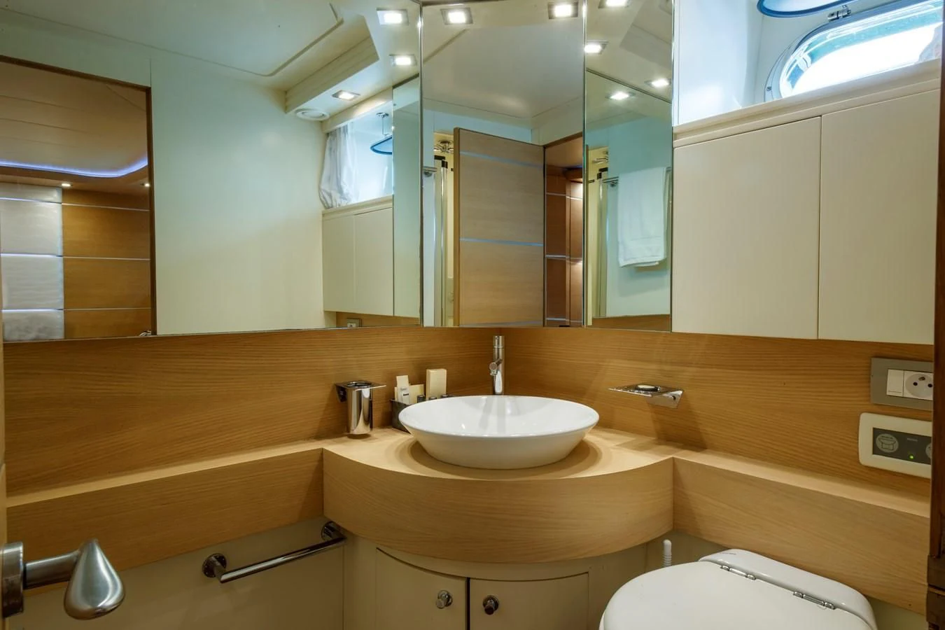 a bathroom with a sink and a mirror aboard KOKAB Yacht for Charter