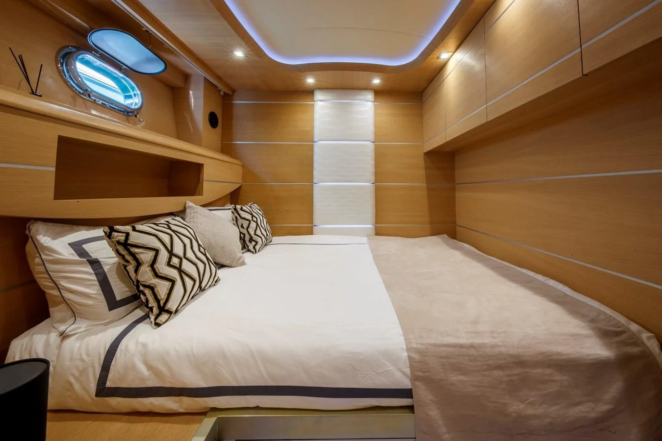 a room with a bed and a window aboard KOKAB Yacht for Charter
