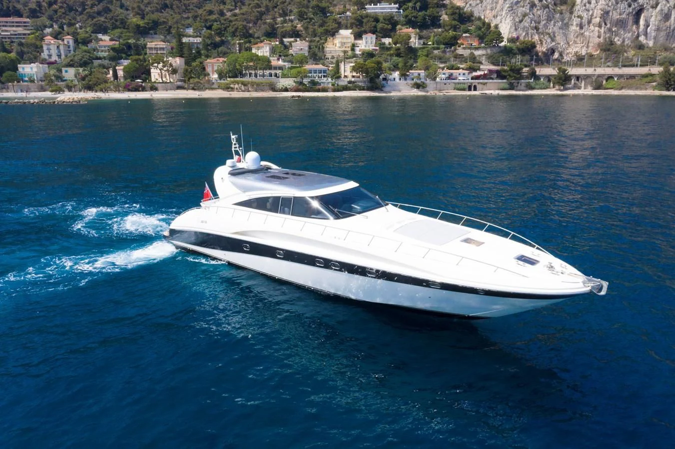 a white yacht on the water aboard KOKAB Yacht for Charter