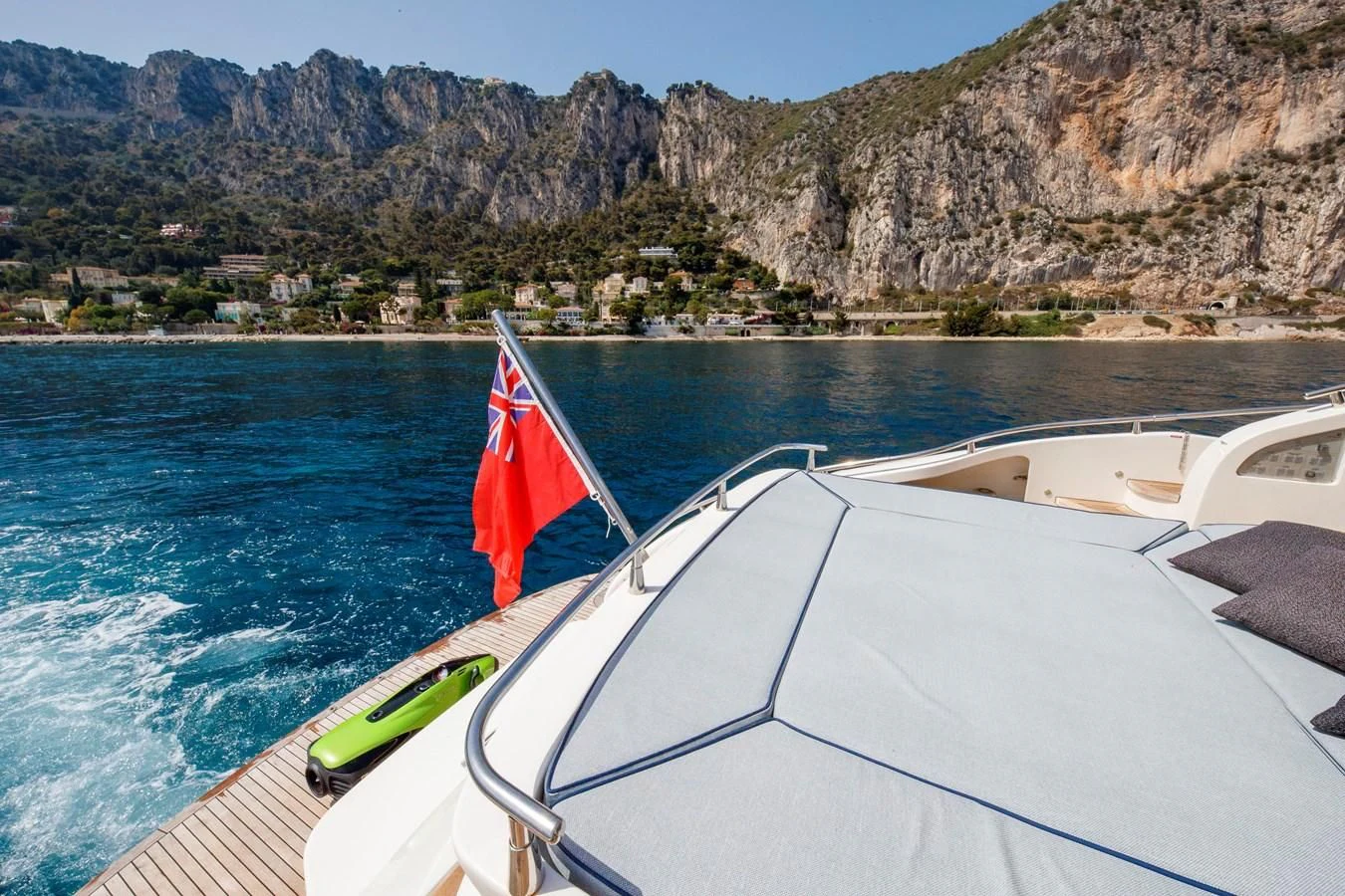 a boat with a flag on it aboard KOKAB Yacht for Charter