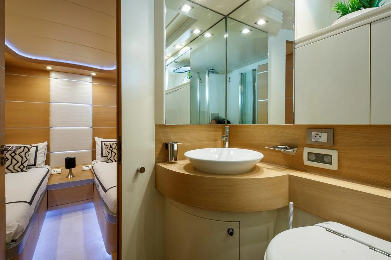 a bathroom with a large mirror aboard KOKAB Yacht for Charter