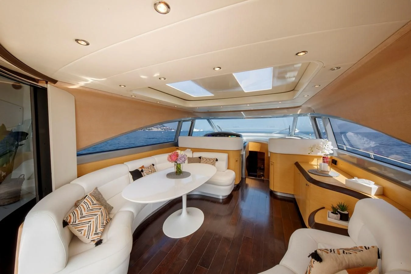 a room with a table and chairs aboard KOKAB Yacht for Charter