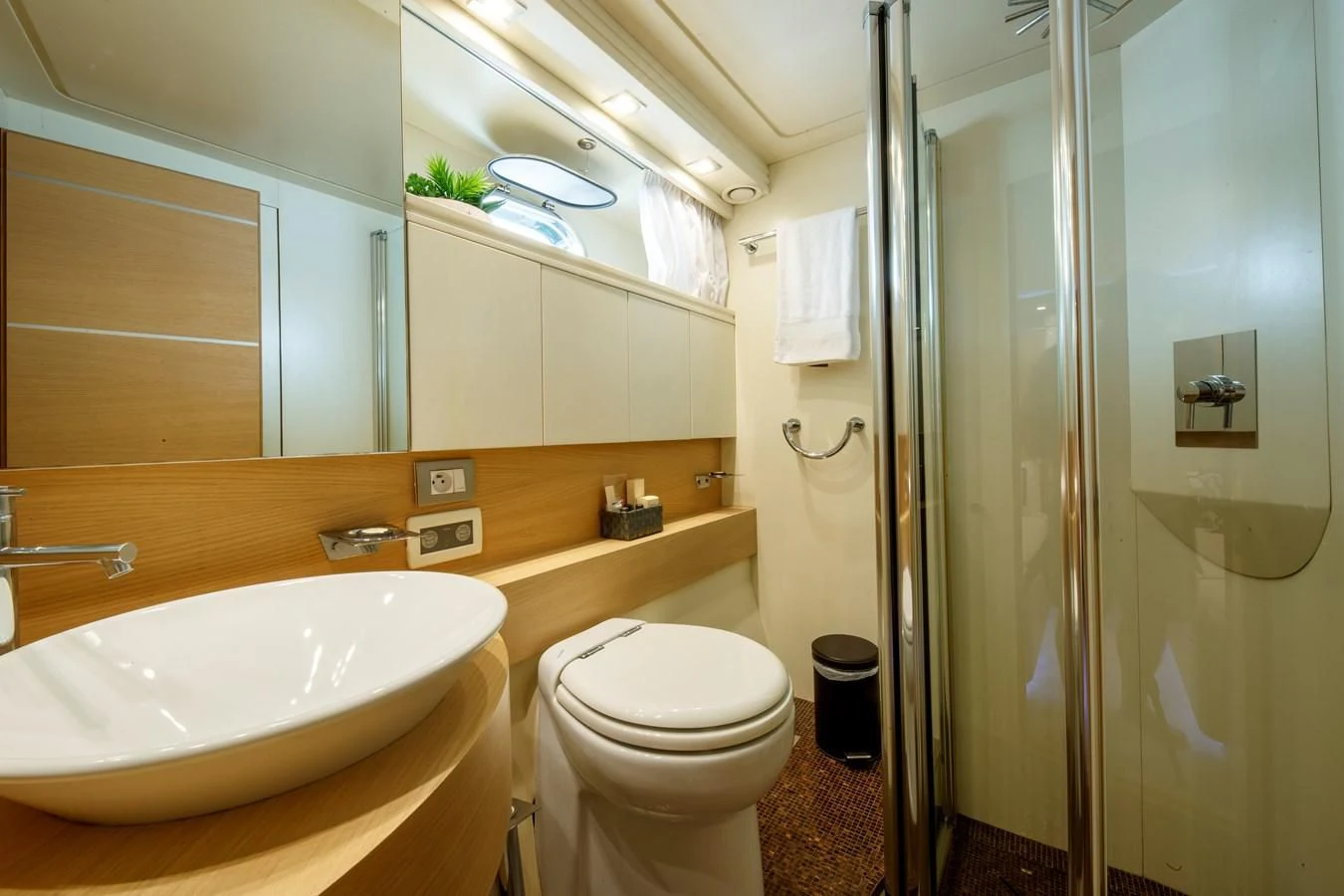 a bathroom with a sink toilet and shower aboard KOKAB Yacht for Charter