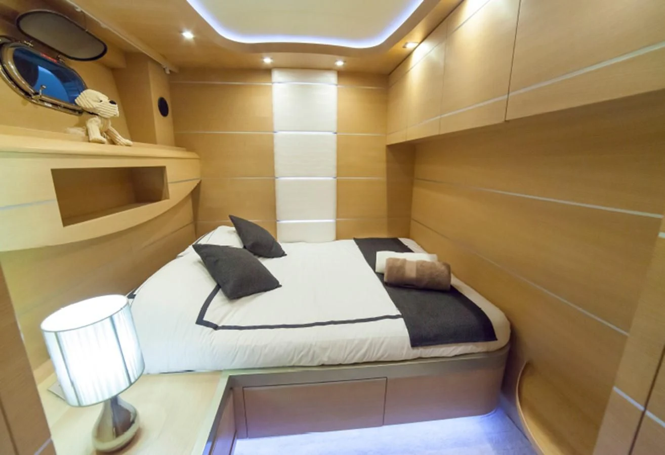 a bed in a room aboard KOKAB Yacht for Charter