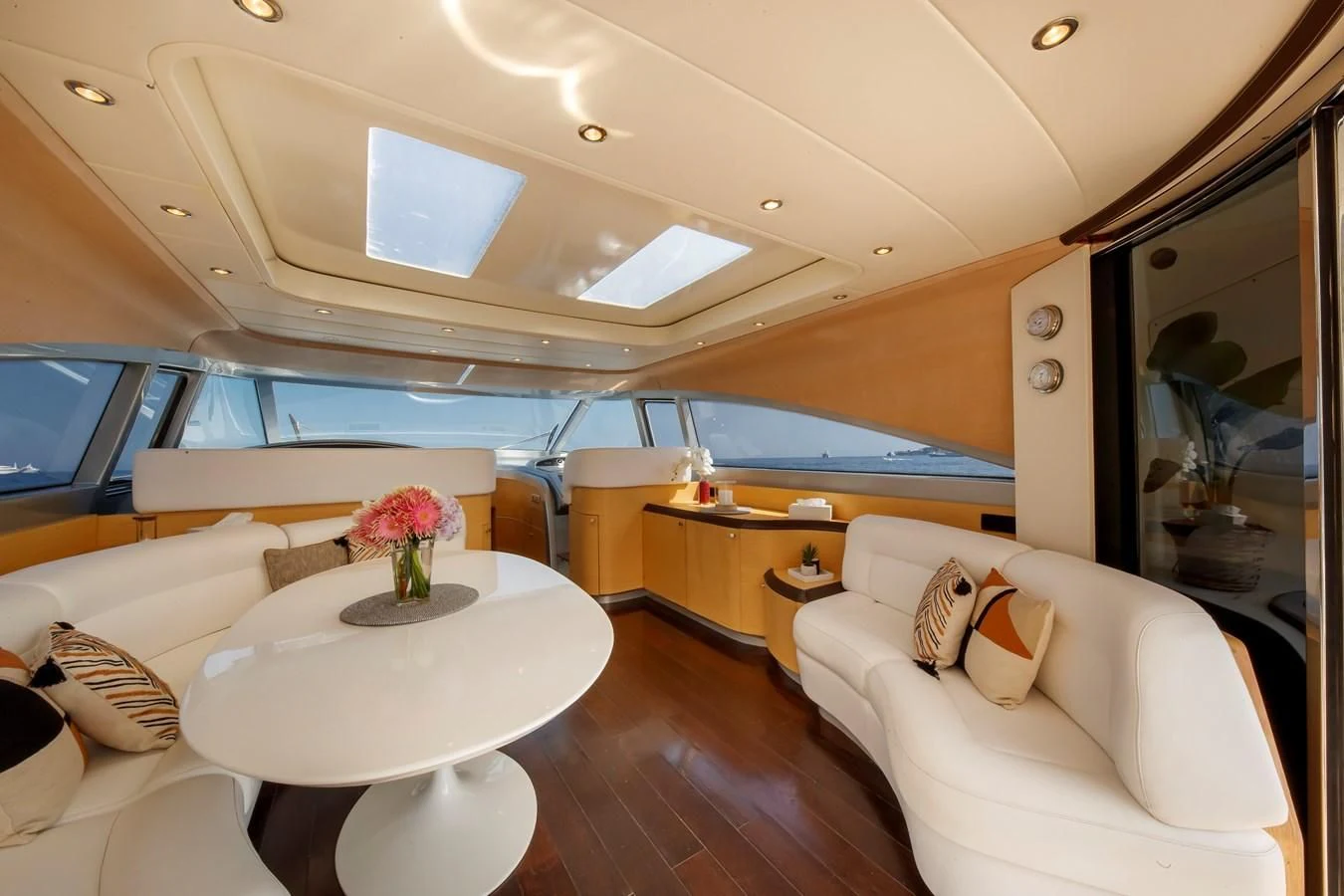 a room with a table and a couch aboard KOKAB Yacht for Charter