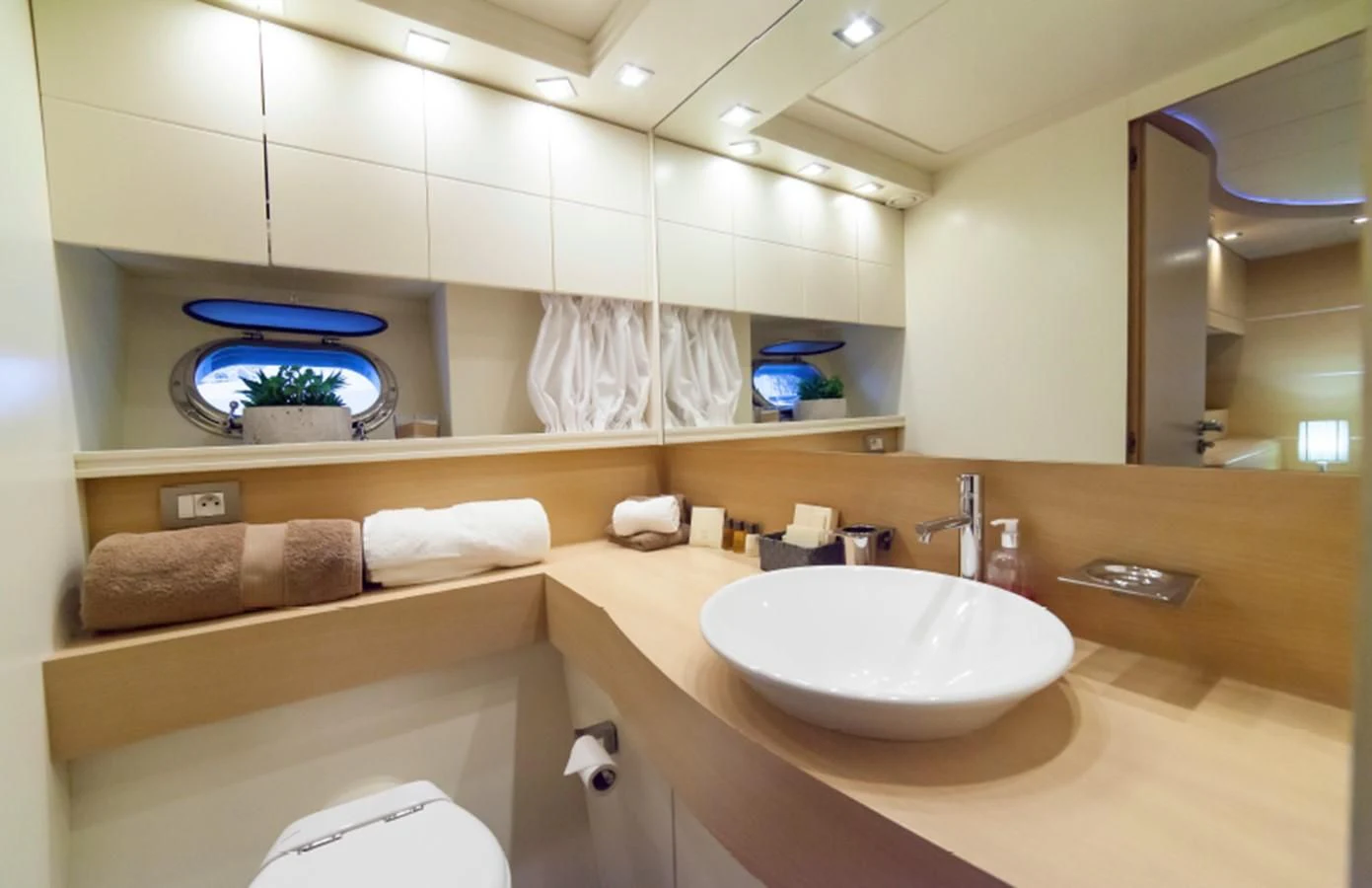 a bathroom with a sink and a mirror aboard KOKAB Yacht for Charter