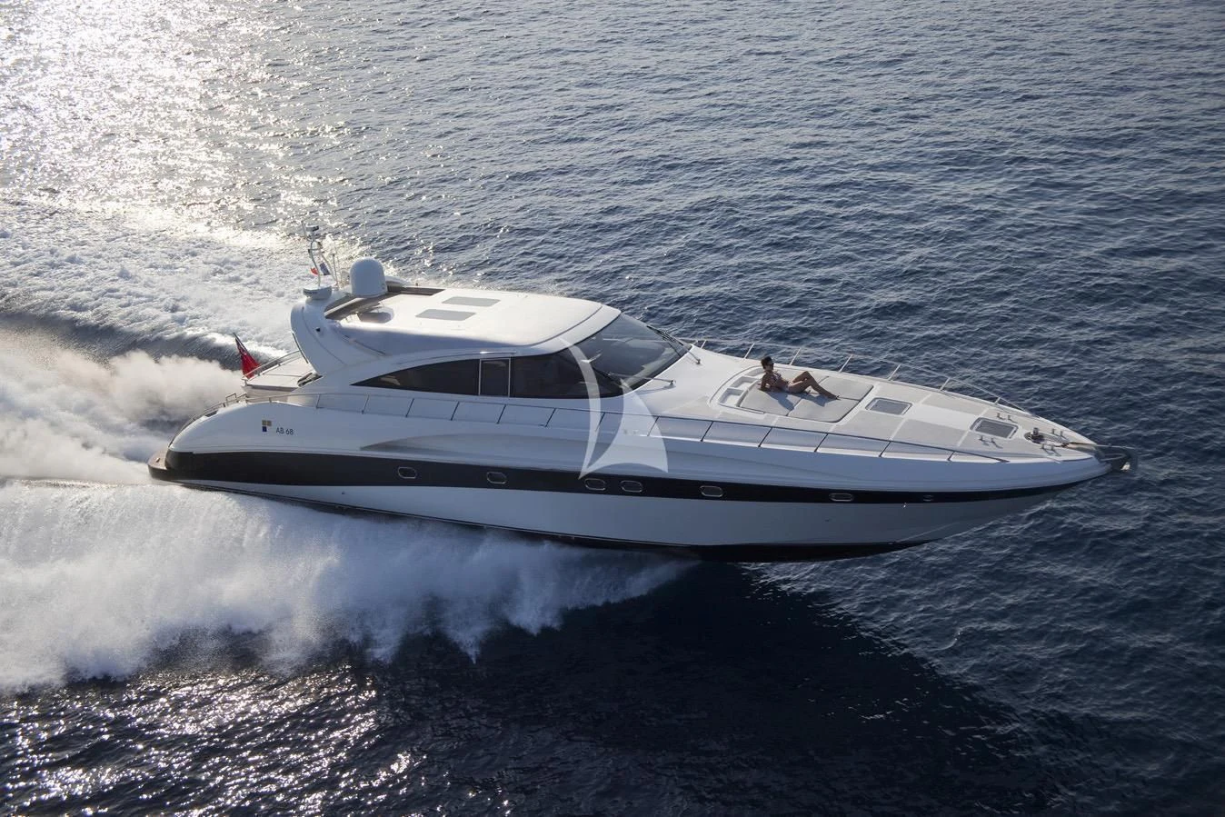 a white yacht on the water aboard KOKAB Yacht for Charter