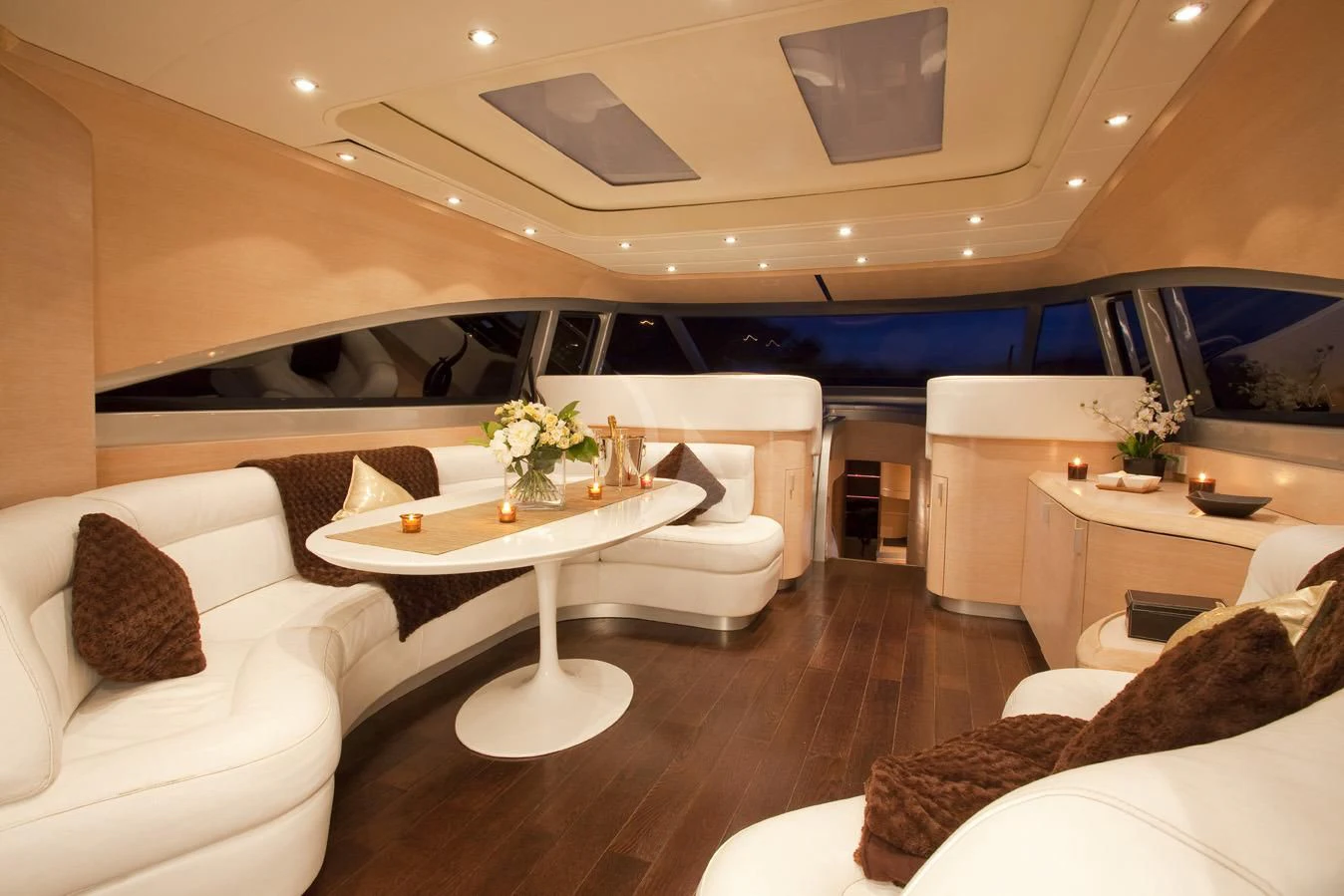a room with a table and couches aboard KOKAB Yacht for Charter