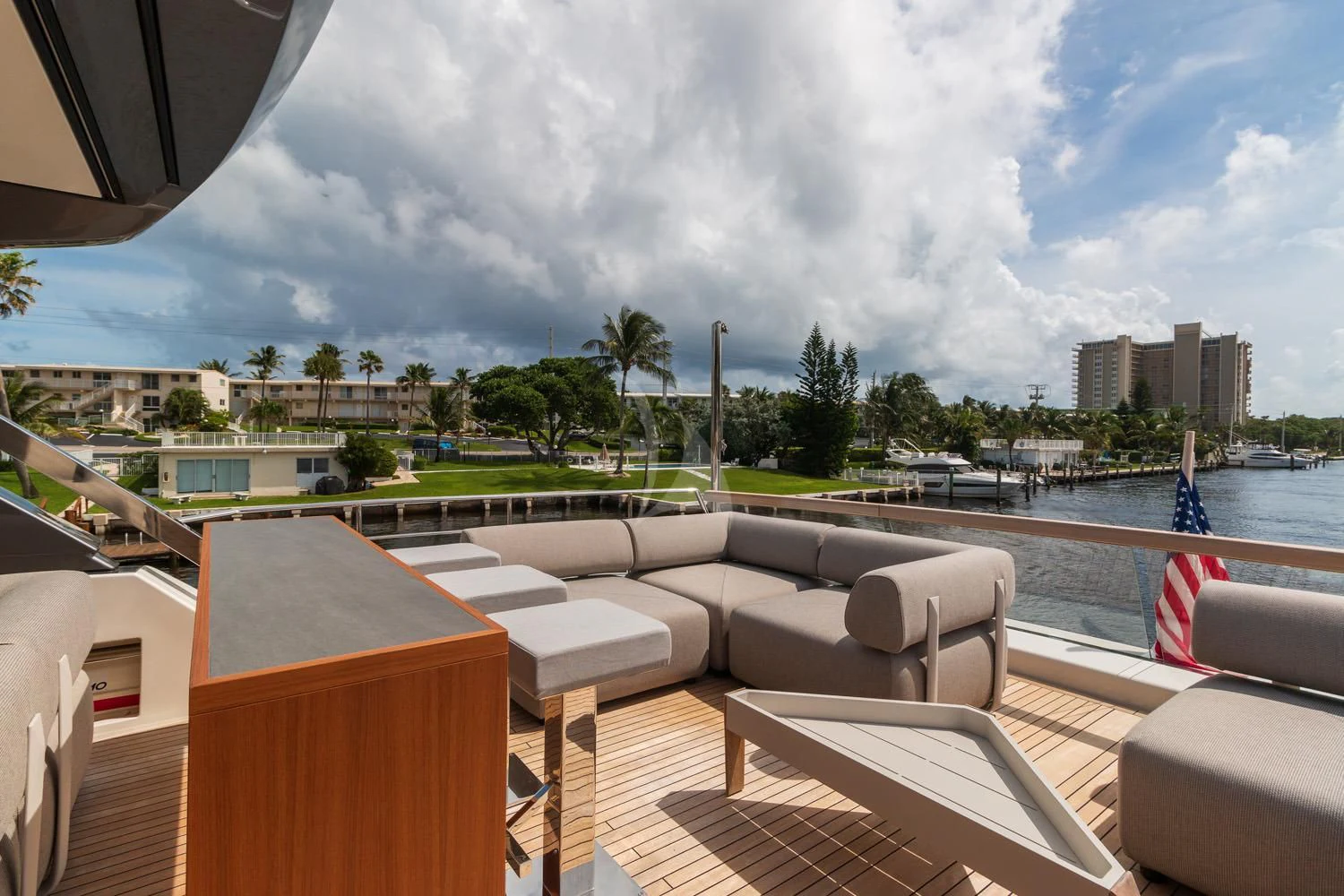 a deck with chairs and a body of water in the background aboard SWEET VIRGINIA Yacht for Sale