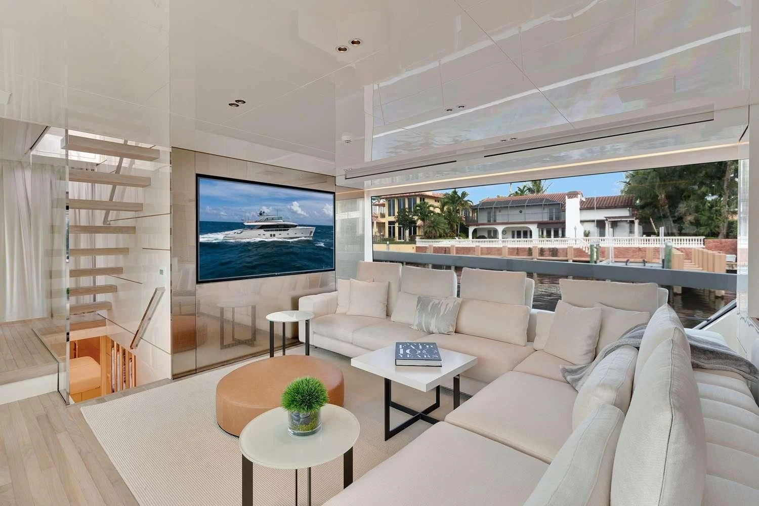 a living room with a large screen aboard SWEET VIRGINIA Yacht for Sale