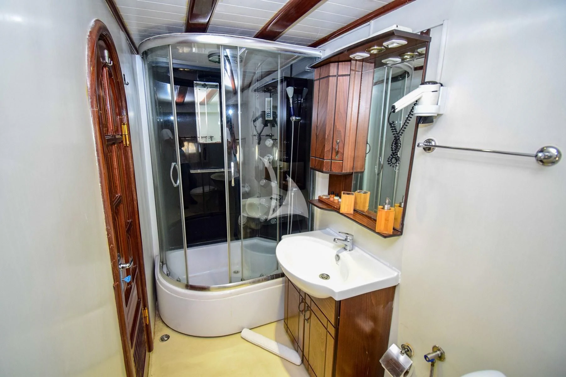 a bathroom with a shower and sink aboard UGUR Yacht for Sale