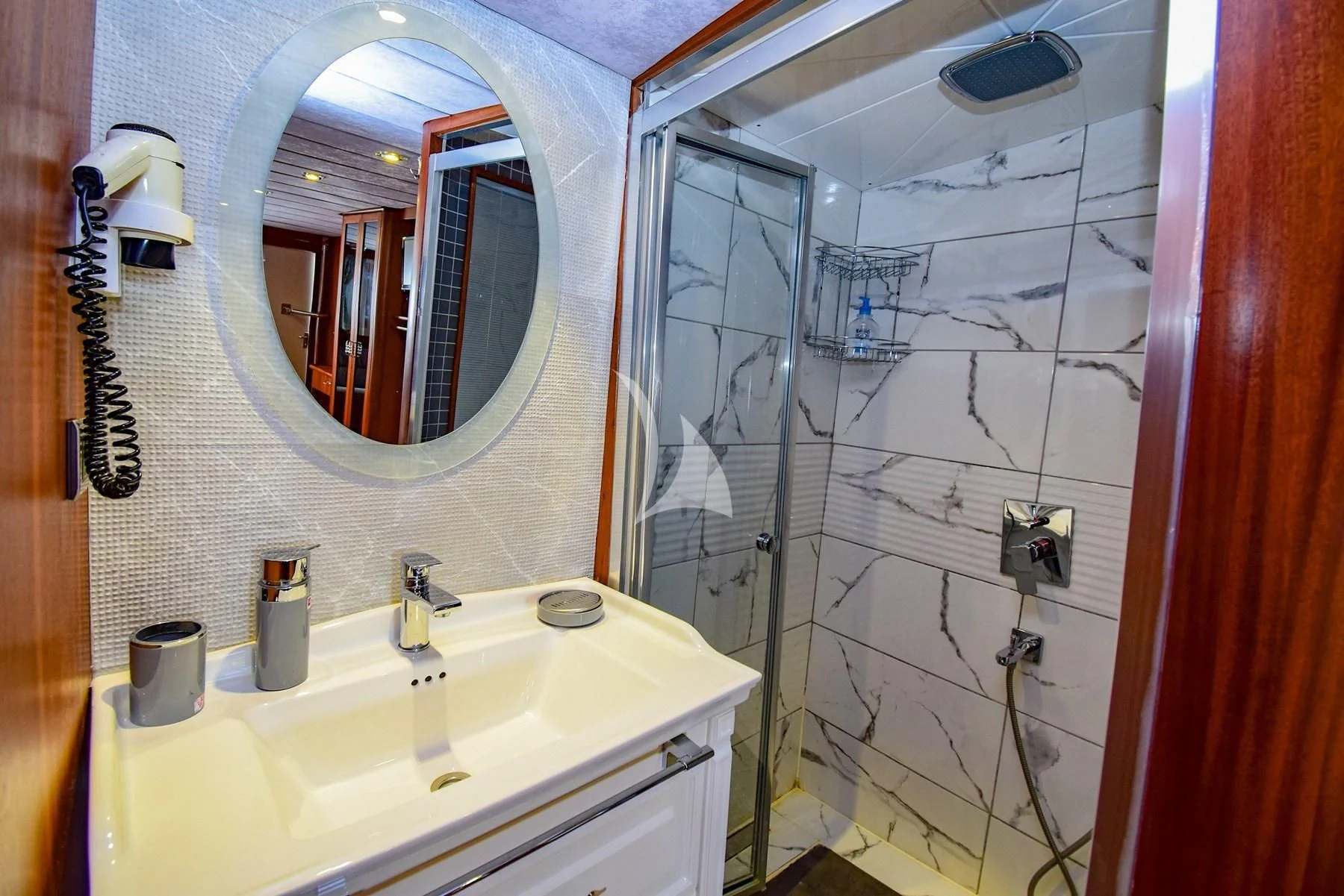 a bathroom with a sink and a shower aboard UGUR Yacht for Sale