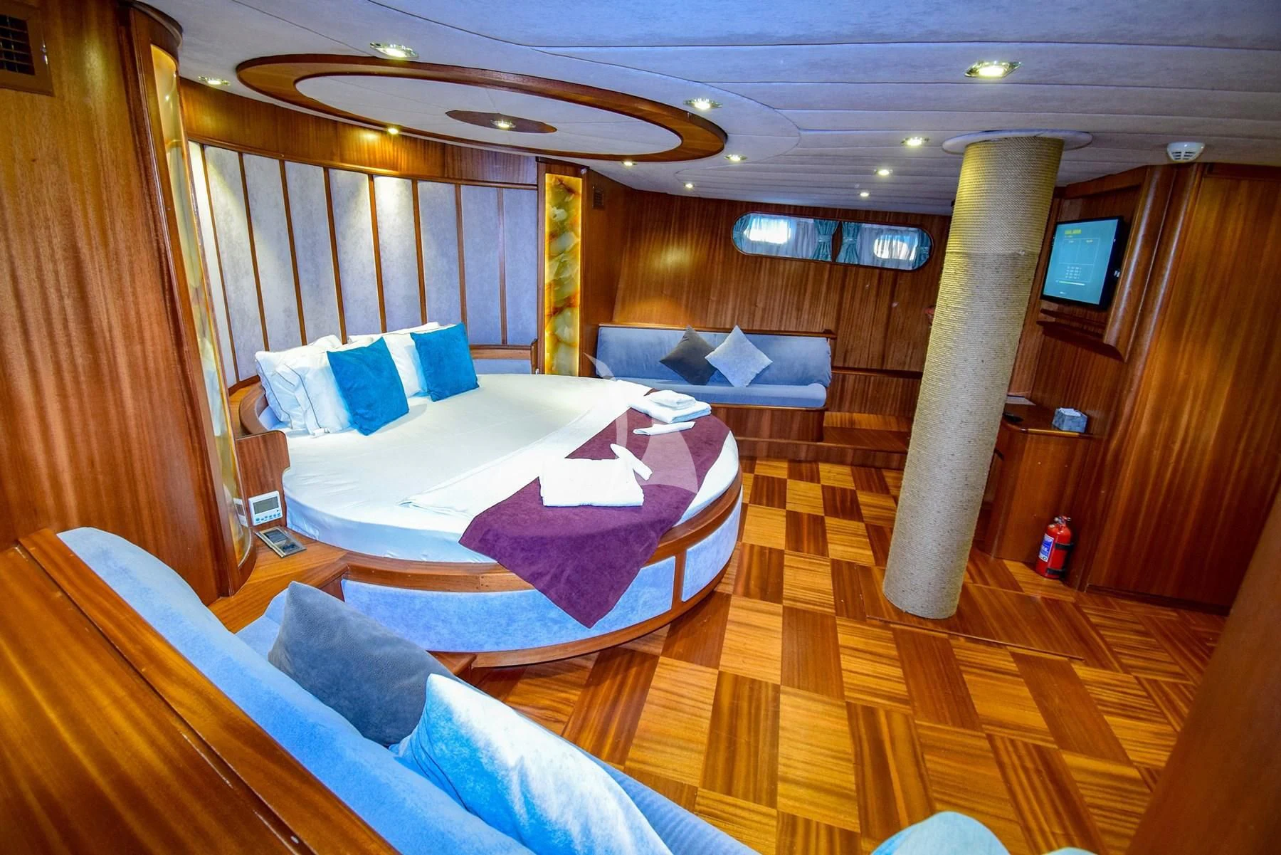 a room with a couple beds aboard UGUR Yacht for Sale