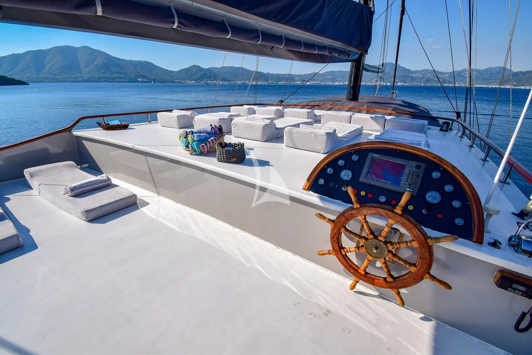 a boat with a large ship on it aboard UGUR Yacht for Sale
