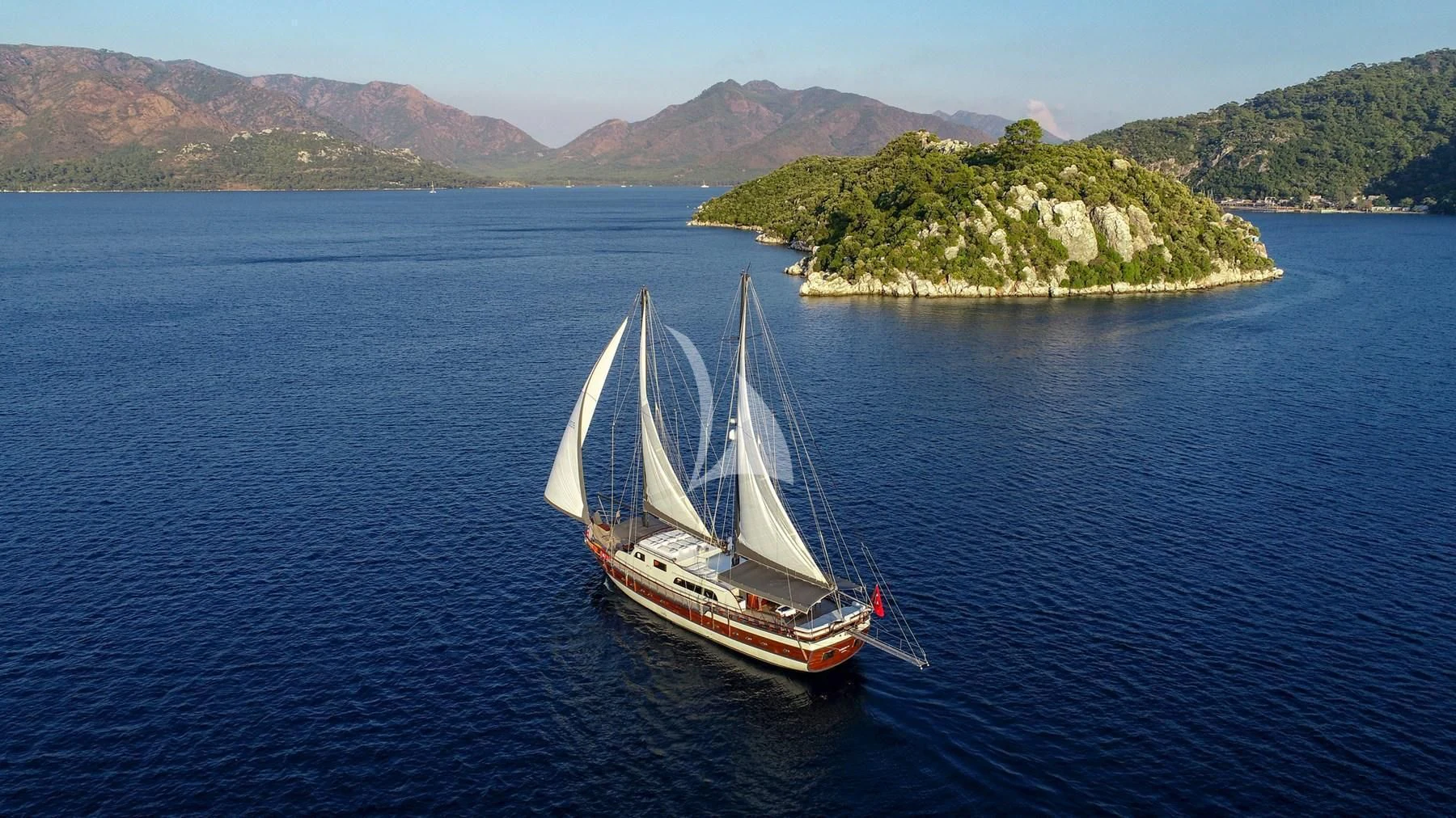 a sailboat on the water aboard UGUR Yacht for Sale