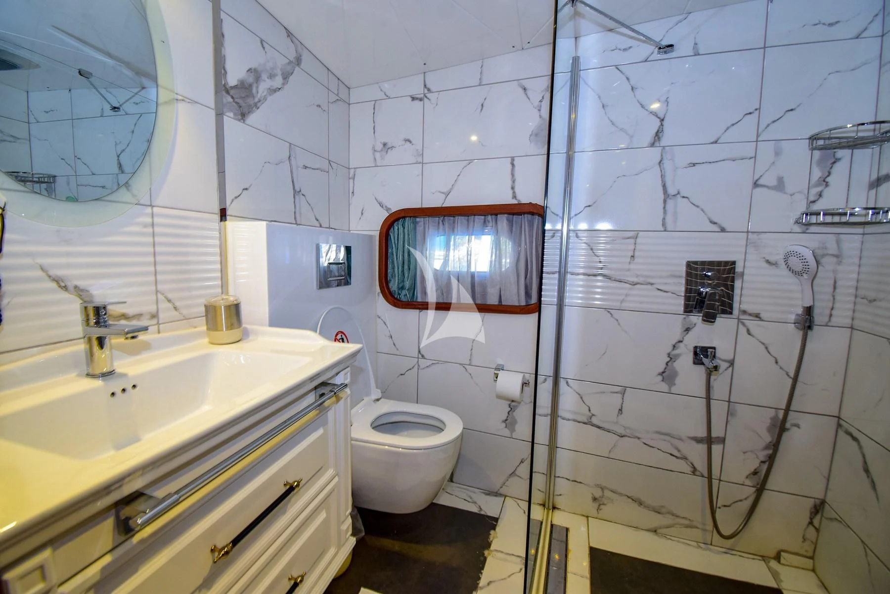 a bathroom with a toilet sink and a bathtub aboard UGUR Yacht for Sale