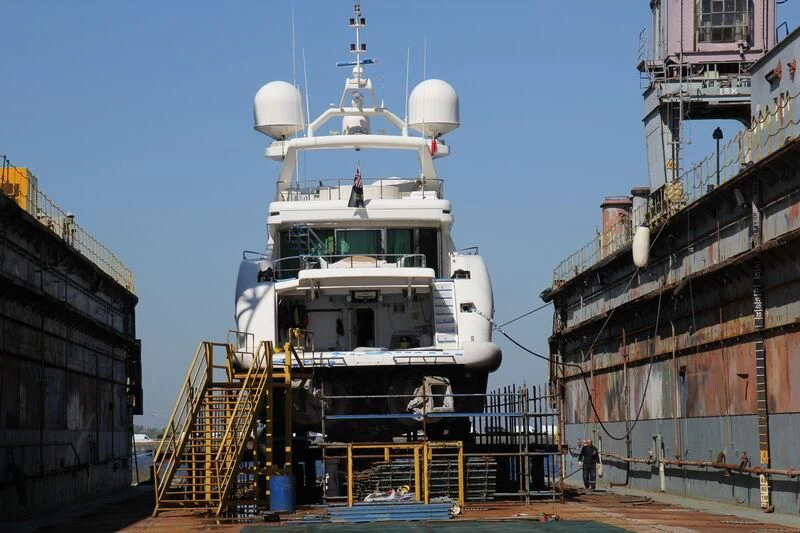 a large white boat in a dock aboard ALFA XII Yacht for Sale