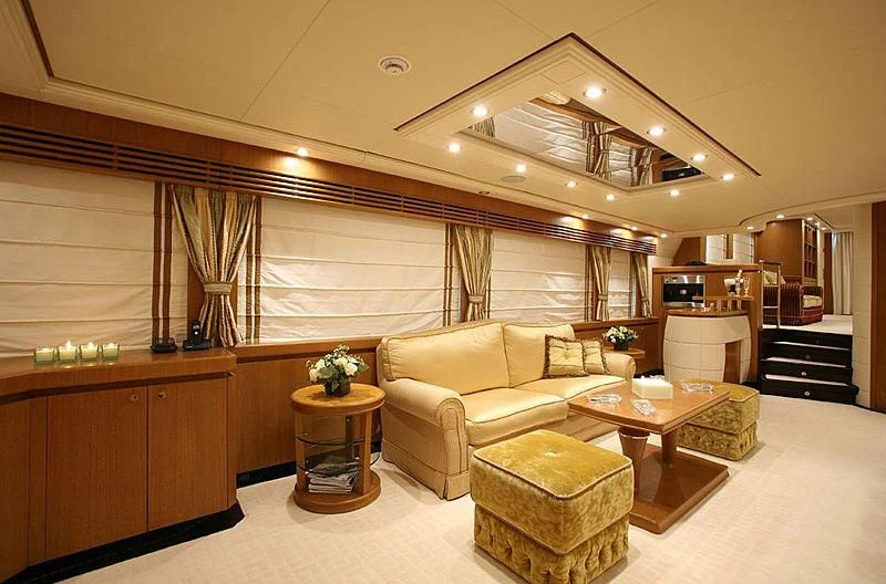 a living room with a couch and a coffee table aboard ALFA XII Yacht for Sale