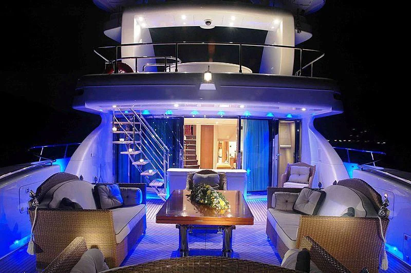 a room with a table and couches aboard ALFA XII Yacht for Sale