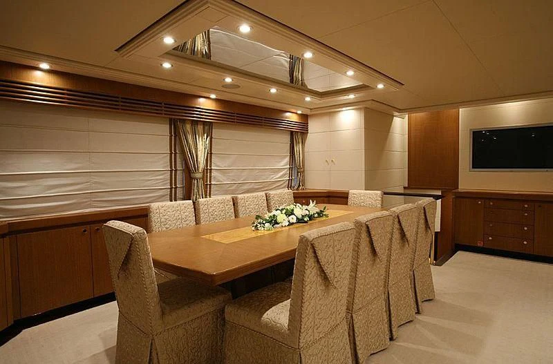 a room with a table and chairs aboard ALFA XII Yacht for Sale