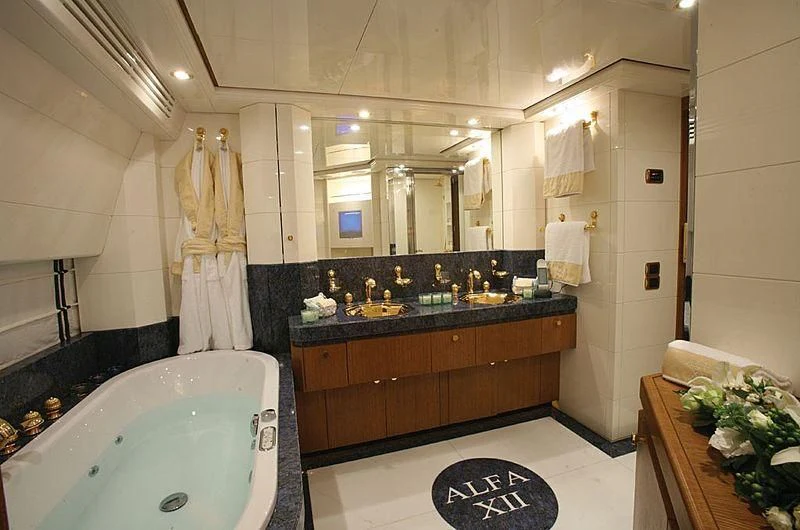 a bathroom with a tub sink and a sink aboard ALFA XII Yacht for Sale