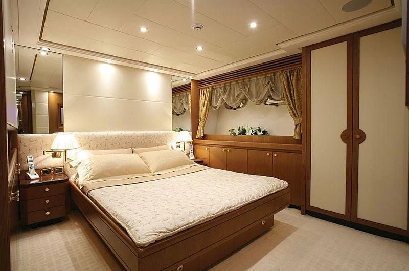a large bedroom with a large bed aboard ALFA XII Yacht for Sale