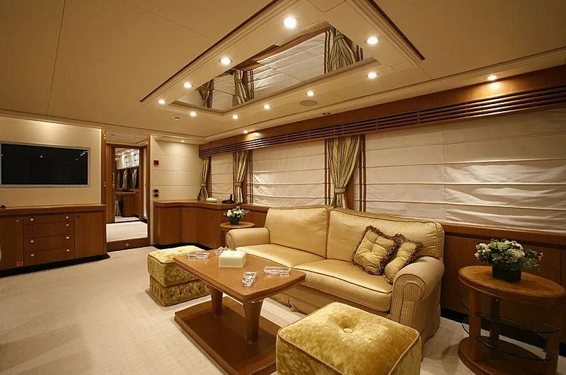 a living room with a couch and a table aboard ALFA XII Yacht for Sale