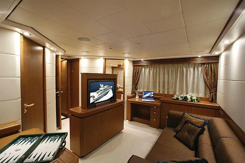 a room with a tv and a couch aboard ALFA XII Yacht for Sale