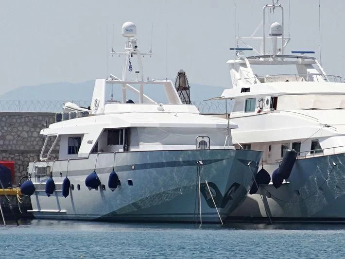 a few large white boats aboard LULLABY Yacht for Sale