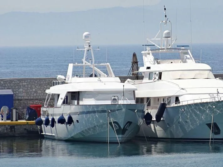 a couple of large white boats aboard LULLABY Yacht for Sale
