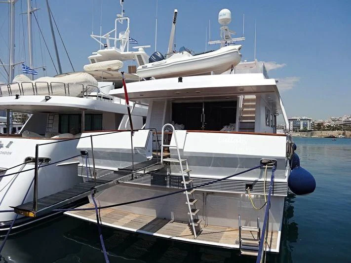 a boat docked at a pier aboard LULLABY Yacht for Sale