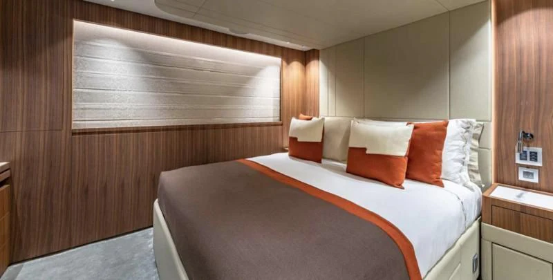 a bed with a white sheet aboard RISING DAWN Yacht for Sale