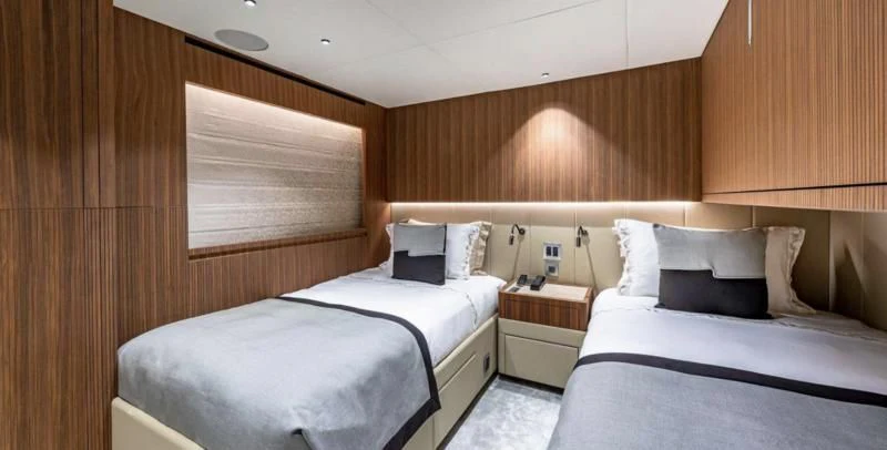 a room with two beds aboard RISING DAWN Yacht for Sale