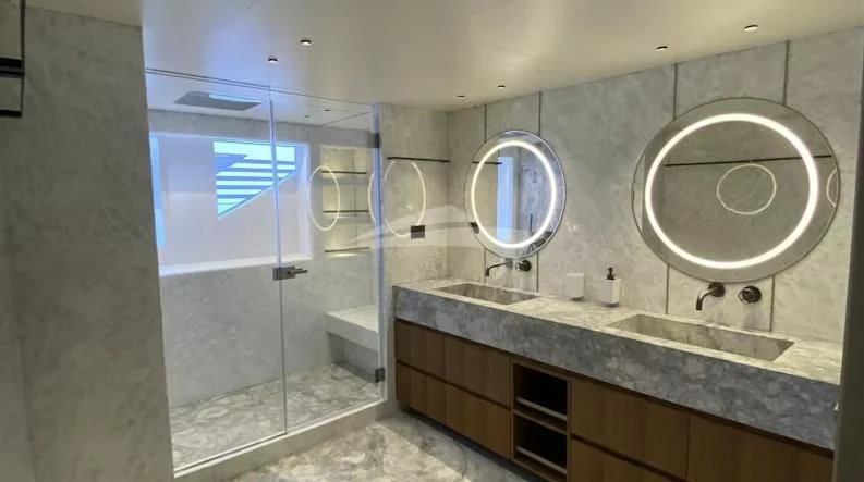 a bathroom with a large mirror aboard RISING DAWN Yacht for Sale