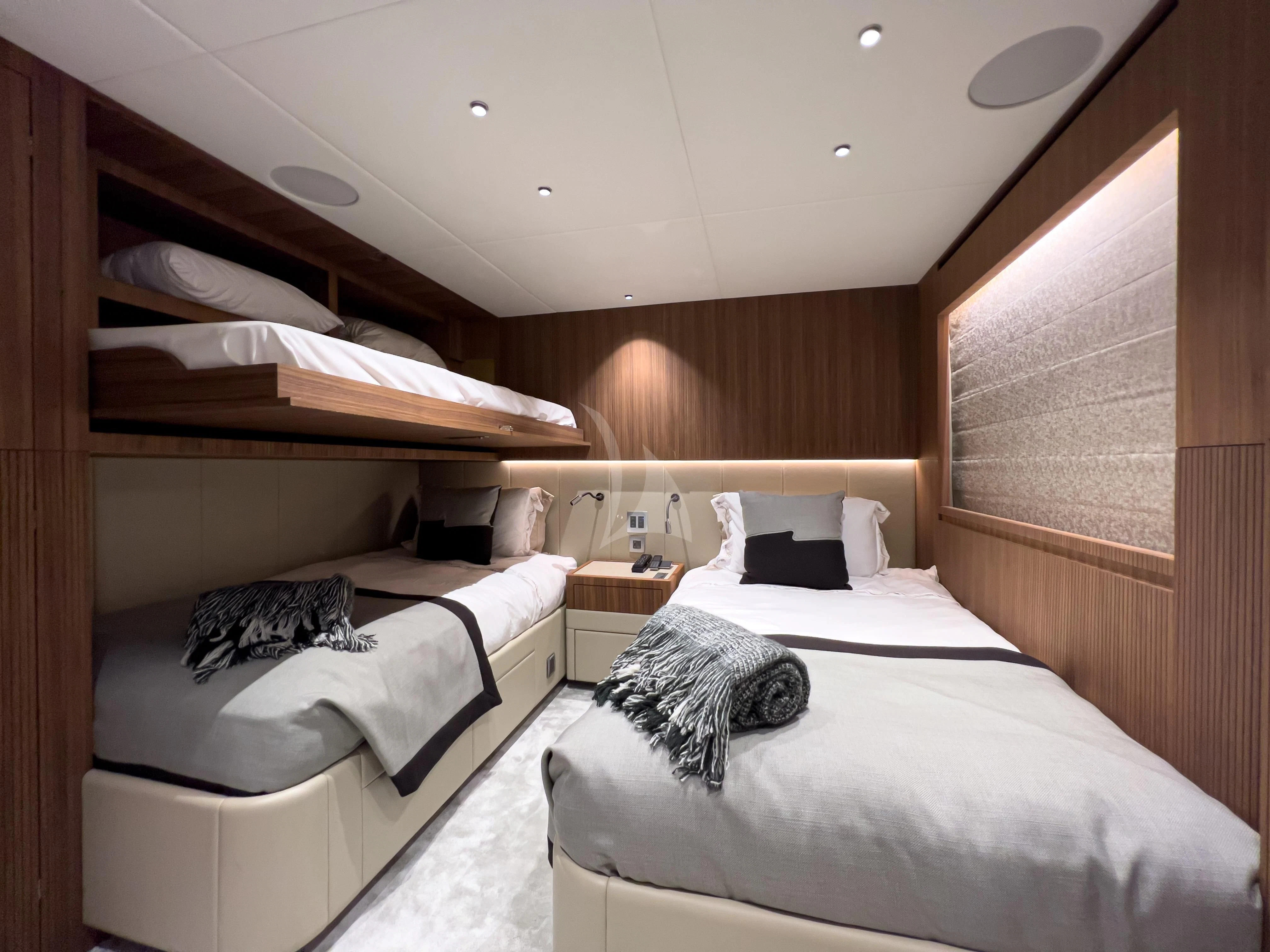 a room with two beds aboard RISING DAWN Yacht for Sale