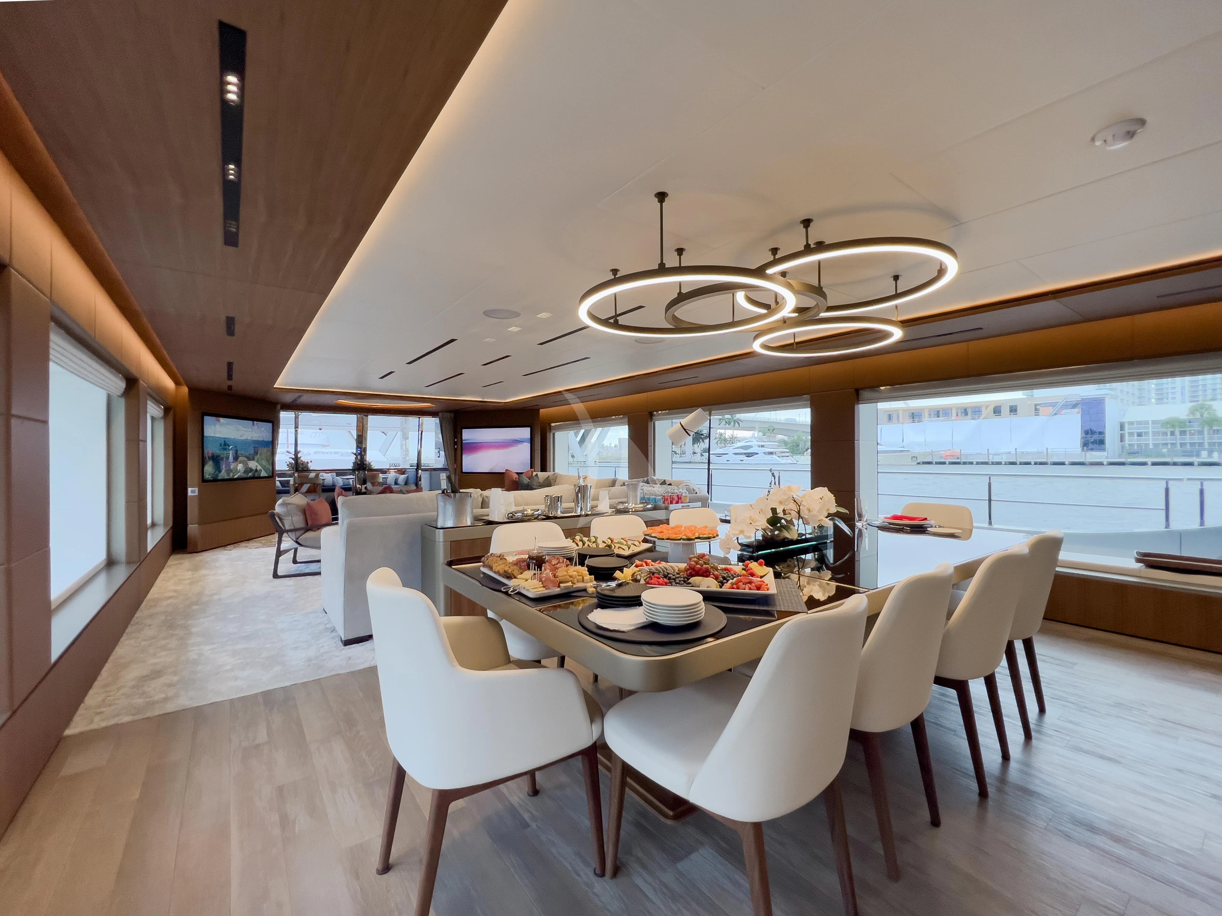 a large kitchen with a dining table aboard RISING DAWN Yacht for Sale