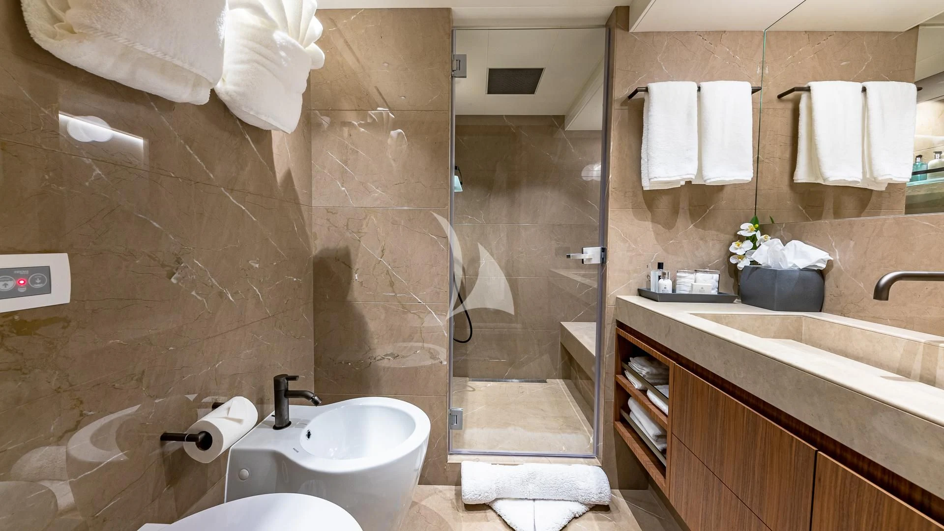 a bathroom with a glass shower aboard RISING DAWN Yacht for Sale