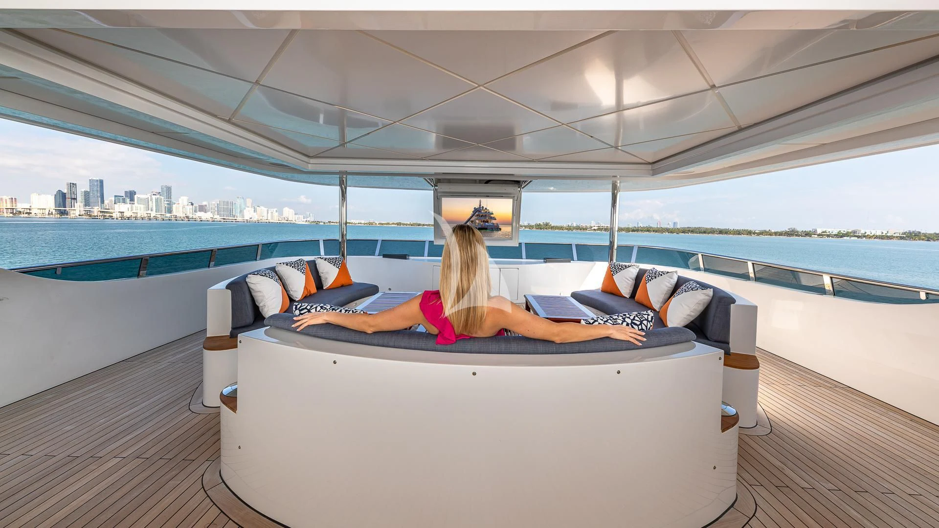 a person lying on a couch aboard RISING DAWN Yacht for Sale
