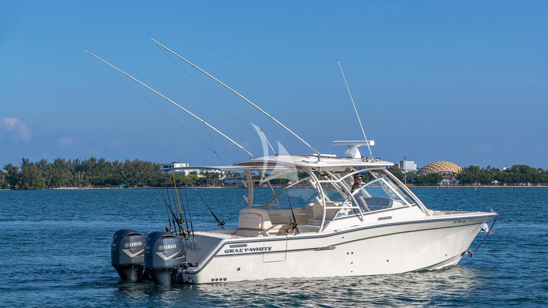 a white boat on the water aboard RISING DAWN Yacht for Sale
