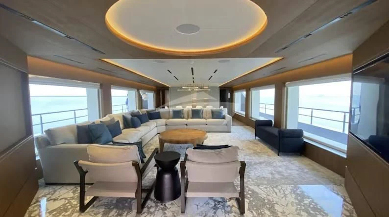 a living room with a large window aboard RISING DAWN Yacht for Sale