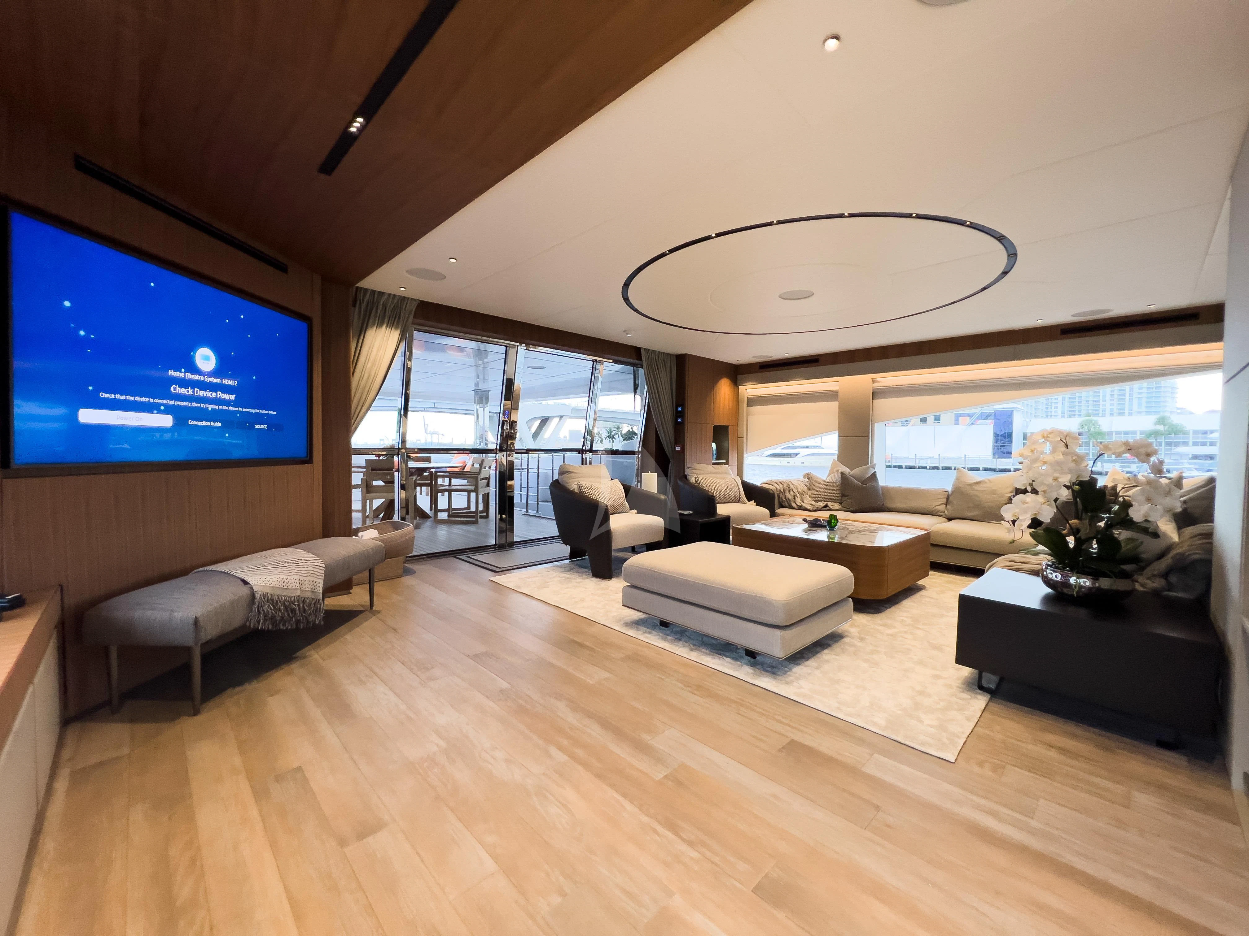 a living room with a large screen aboard RISING DAWN Yacht for Sale