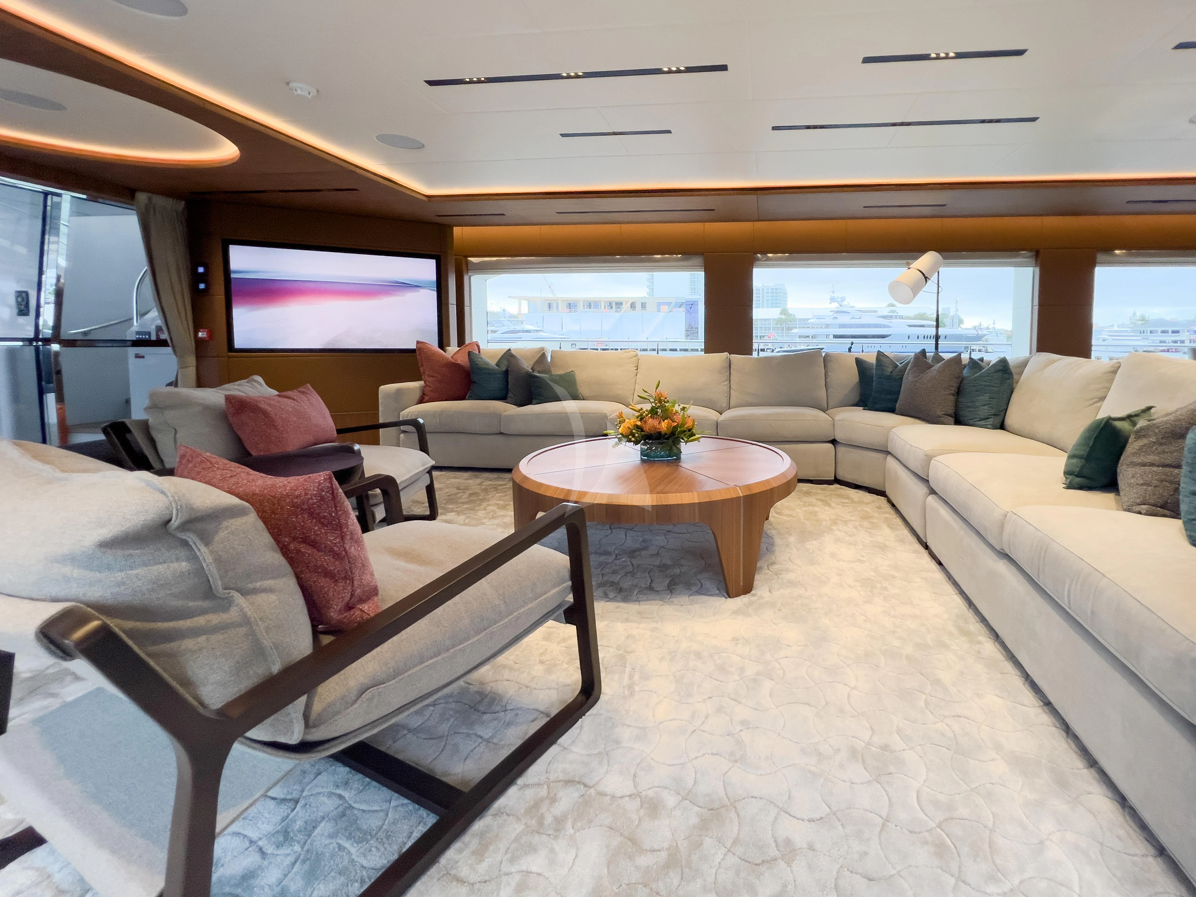 a living room with a couch and a table aboard RISING DAWN Yacht for Sale