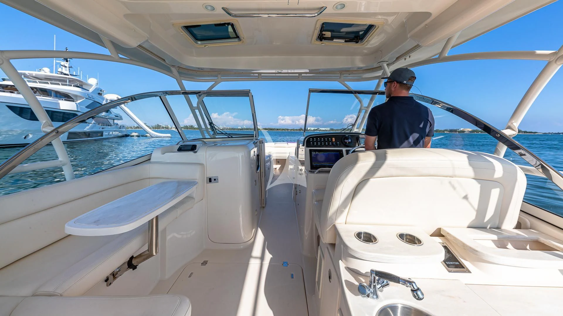 a person standing on the deck of a boat aboard RISING DAWN Yacht for Sale