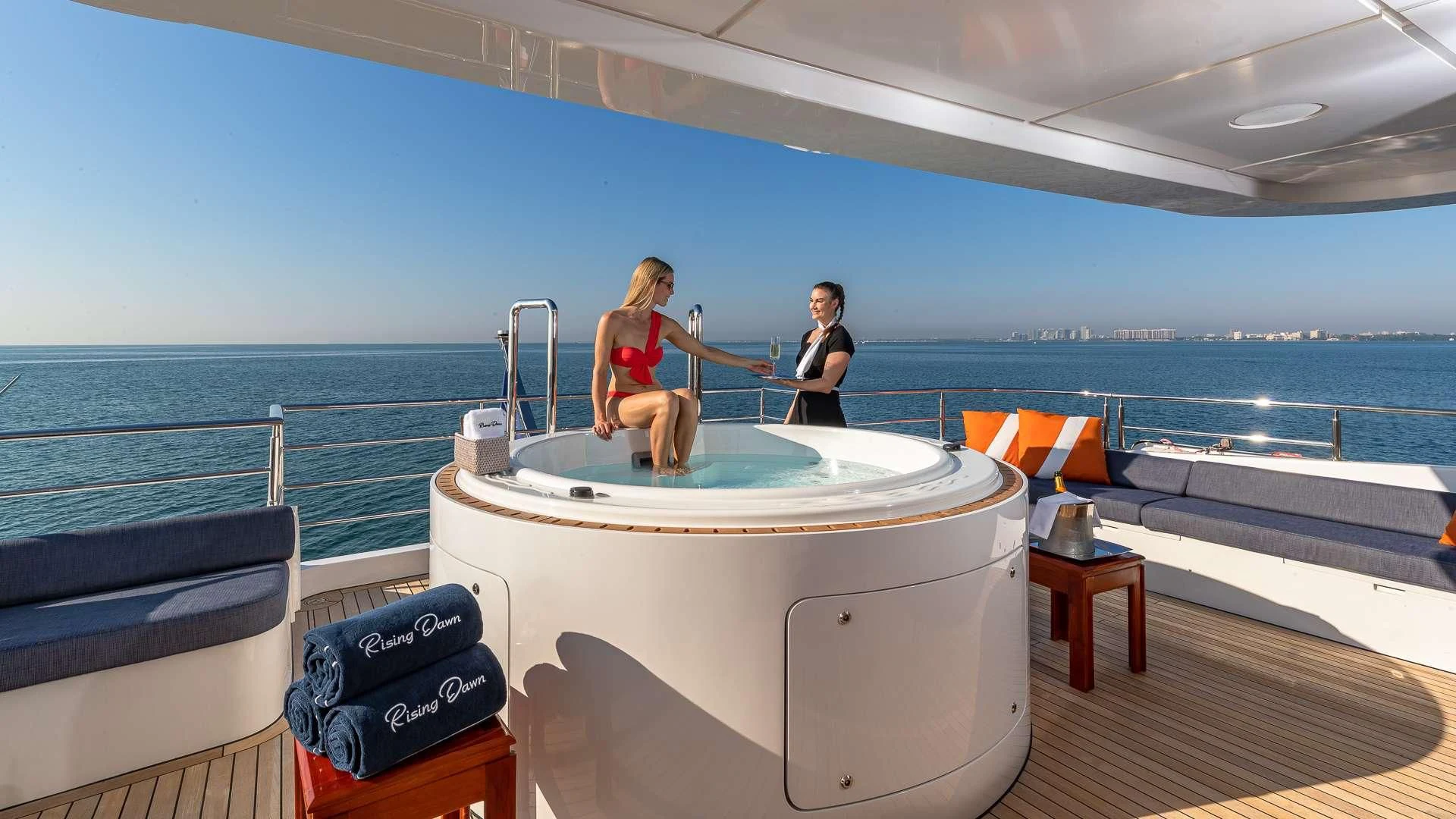 a couple of women on a boat aboard RISING DAWN Yacht for Sale