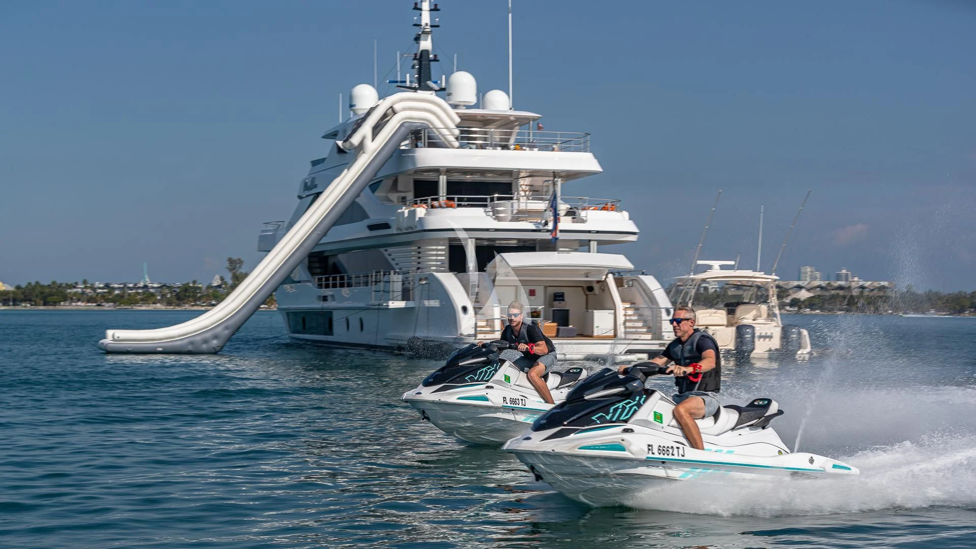 a couple of men on a boat in the water aboard RISING DAWN Yacht for Sale