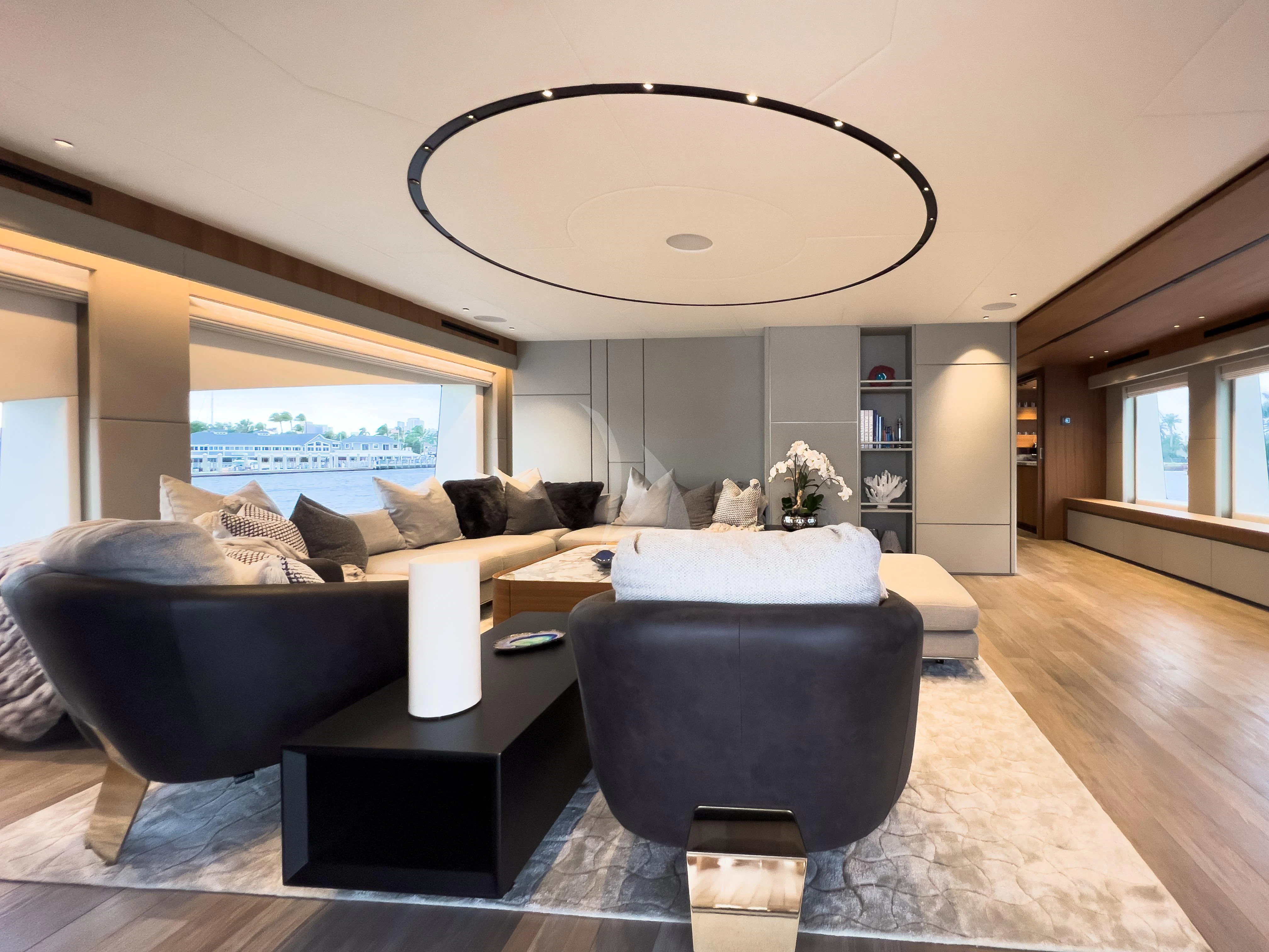 a living room with a large window aboard RISING DAWN Yacht for Sale