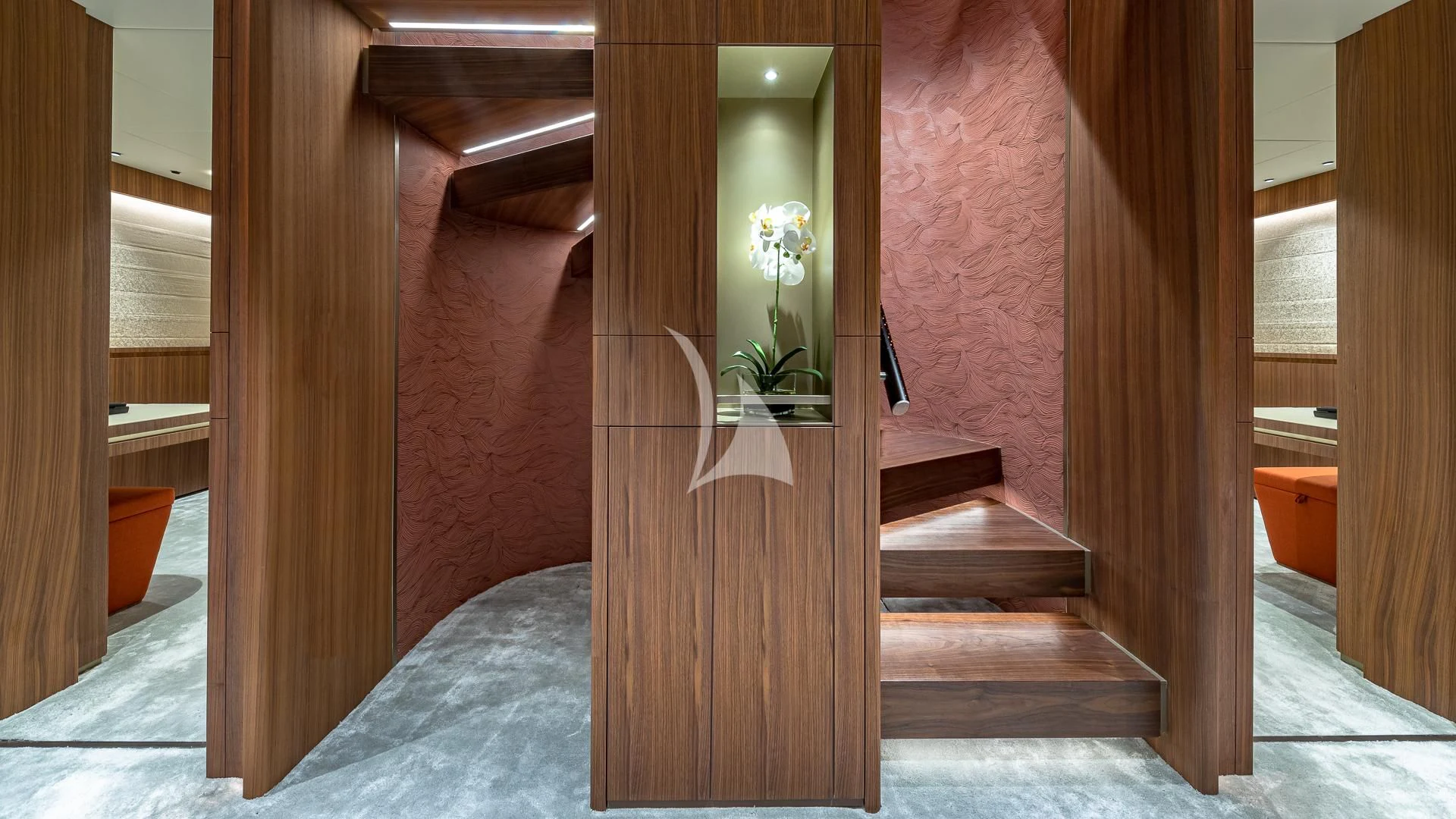 a room with a wood door and a flower vase on the wall aboard RISING DAWN Yacht for Sale