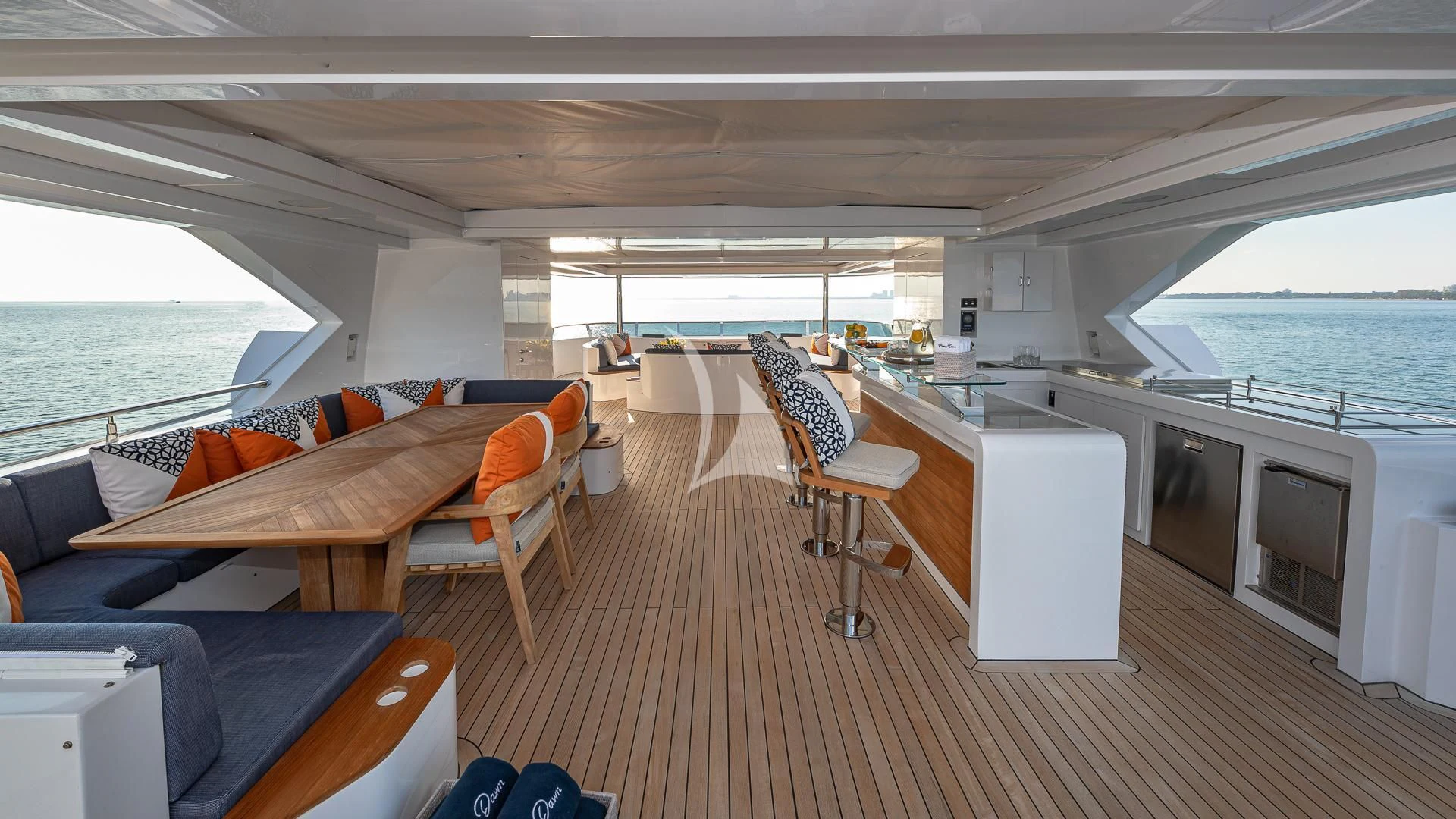 a living room with a couch and a table aboard RISING DAWN Yacht for Sale